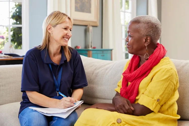 A case manager meeting with a community member